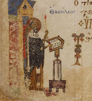 A priest holding a candle in Church