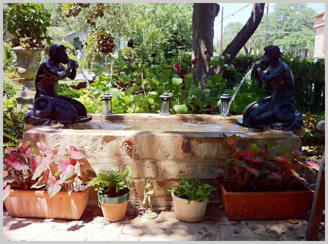 The Bronze Triton mermen on the Laurel Lane Fountain In Austin