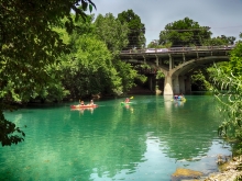 Kayaks on Barton Creek with Barton Springs Rd. Bridge