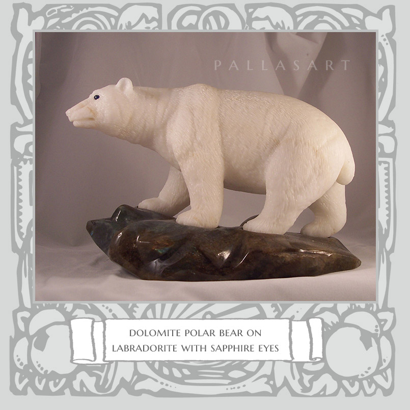 dolomite polar bear on labradorite with sapphire eyes